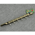 0497 brass flute and peacock key holder wall hanging