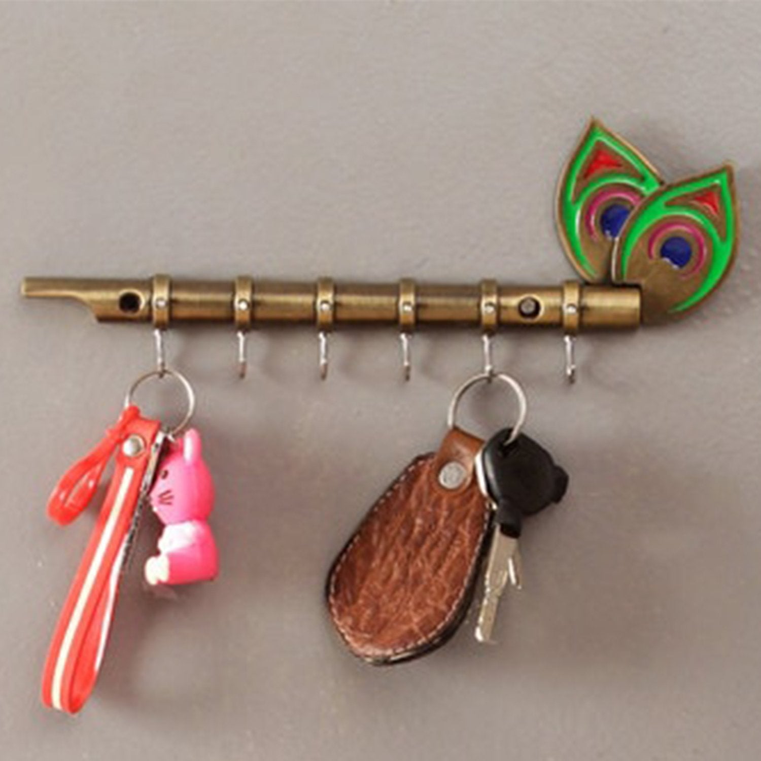 0497 brass flute and peacock key holder wall hanging